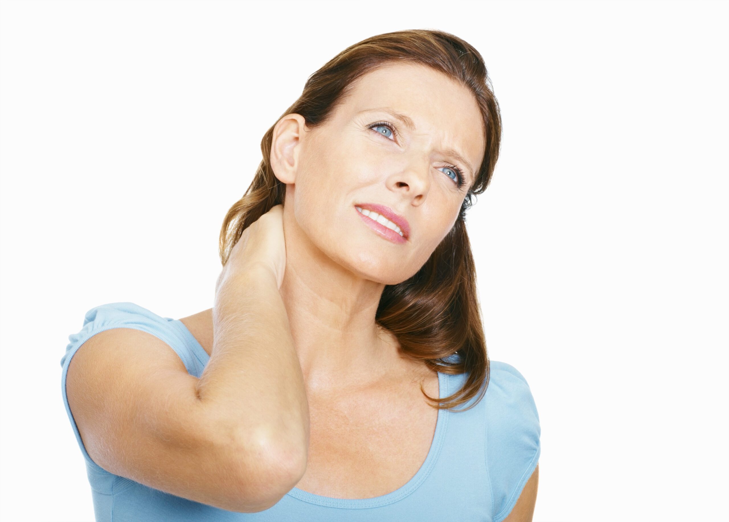 A woman holding her neck looking to be in pain.