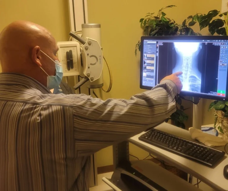 Dr. Brent Wells examining an x-ray image.