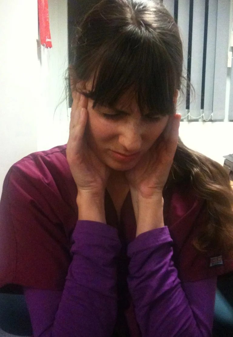 A woman suffering from headache.