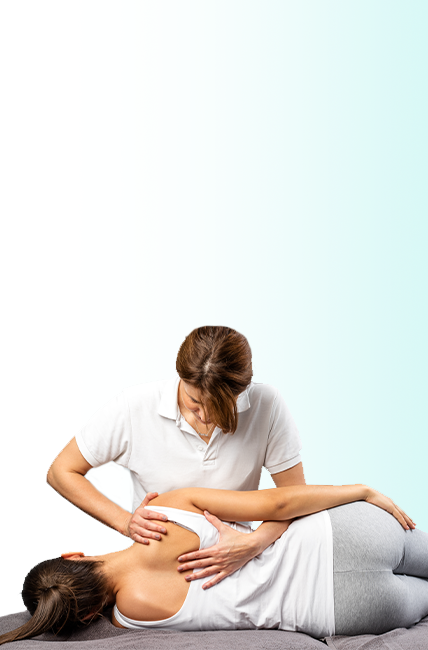 A female patient lying on her side getting treatment for subluxation by a chiropractor.