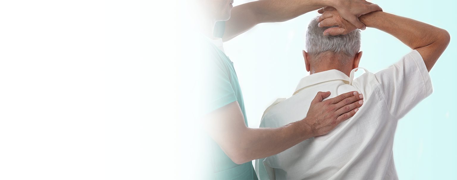 An elderly person receiving care for arthritis from a chiropractor.